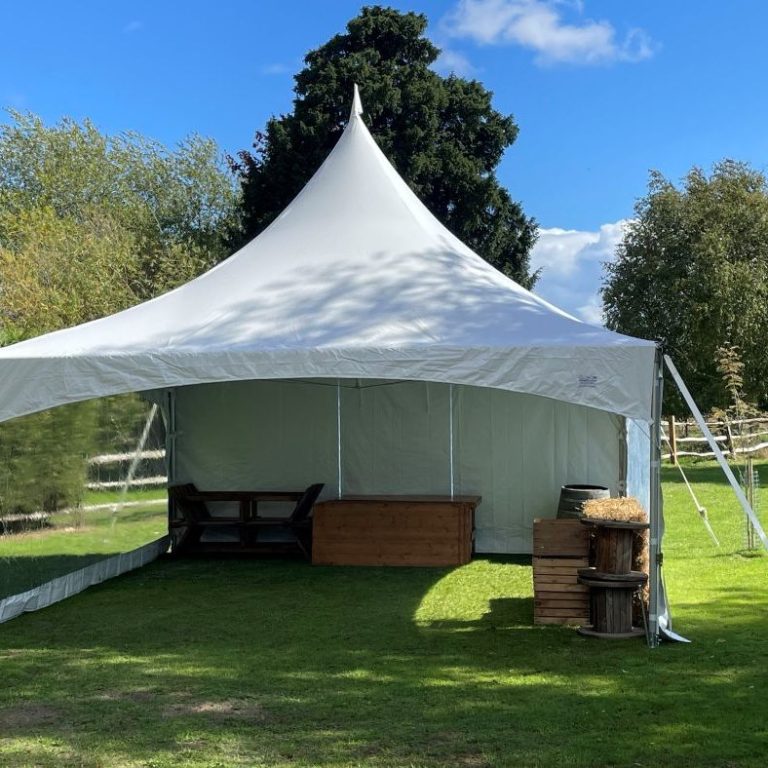 Marquee with sides open on a warm evening