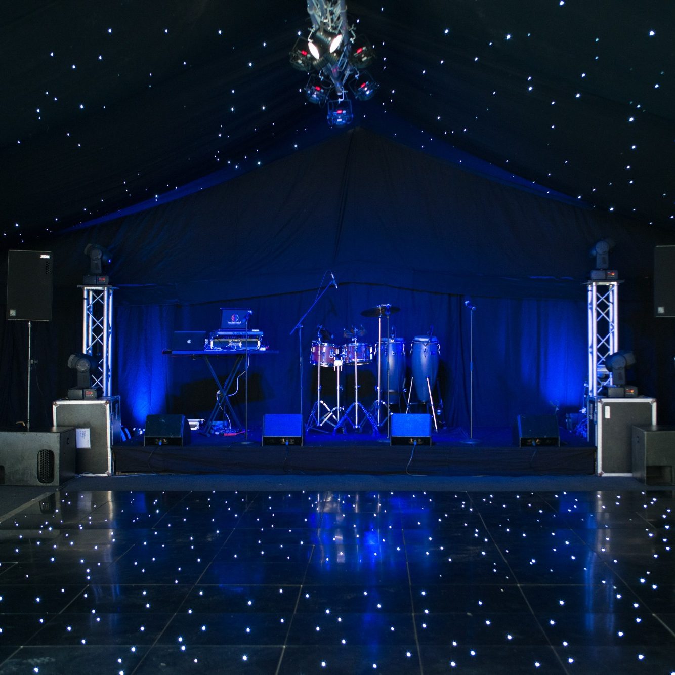 Interior marquee with starlight linings and led dance floor with a stage jpg.