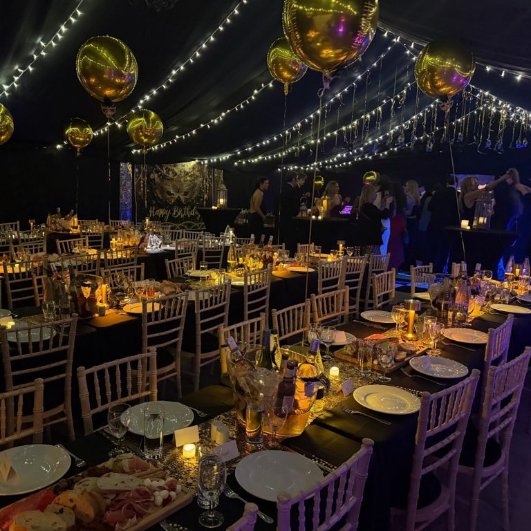 Black out lining and fairy lights in a heated winter marquee.